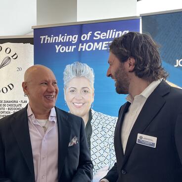 Jon Greenfield, YU’s Assistant Vice President for Government Relations and Vice President of the Washington Heights Chamber of Commerce, greets an event attendee.
